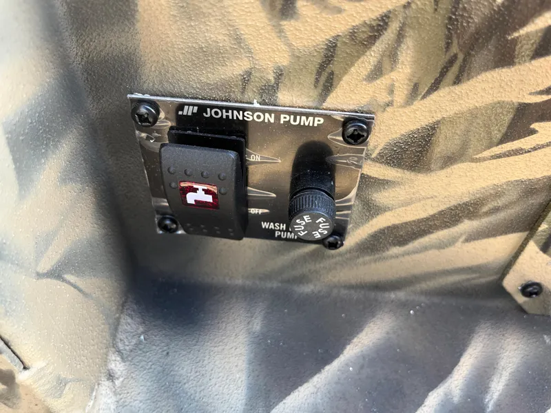 Slide: The Image of Control panel of Johnson Pump in 2024 Lowe Outlet 20 boat. - 21