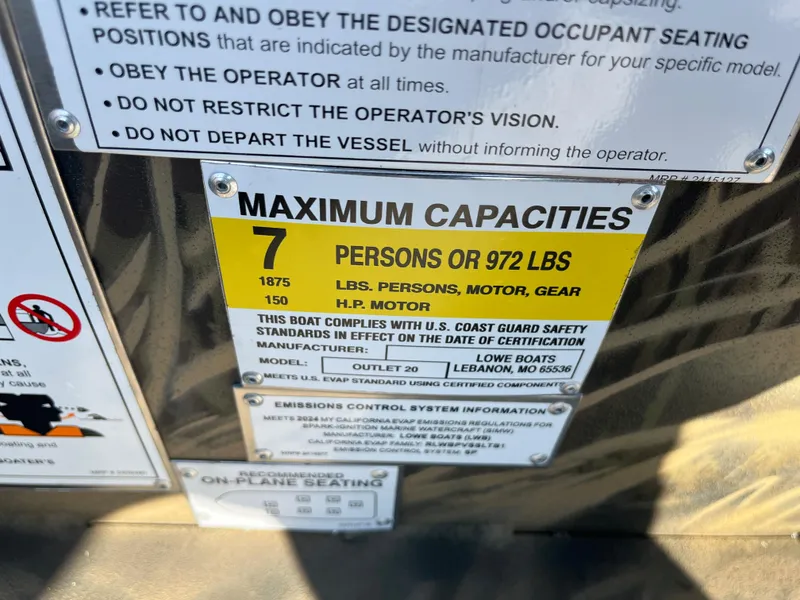 Slide: The Image of 2024 Lowe Outlet 20 boat capacity label: 7 persons or 972 lbs, 150 HP motor. - 23