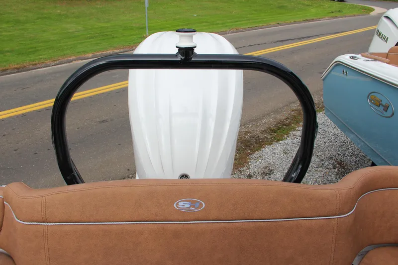 Slide: The Image of 2024 Sea Hunt Ultra 255 SE boat rear view with engine and seating. - 15