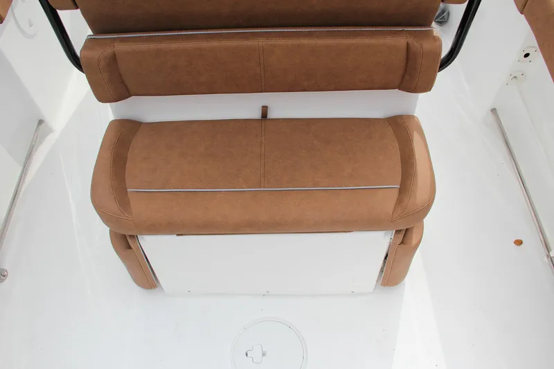 Slide: The Image of 2024 Sea Hunt Ultra 255 SE boat seating with brown upholstery. - 16