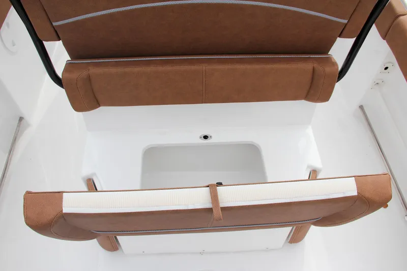 Slide: The Image of 2024 Sea Hunt Ultra 255 SE boat seating and storage compartment. - 17