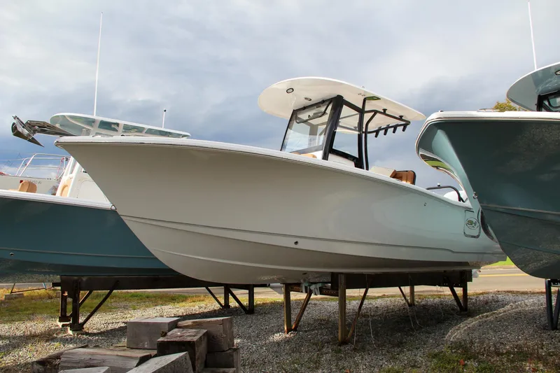 Slide: The Image of 2024 Sea Hunt Ultra 255 SE boat on display. - 2