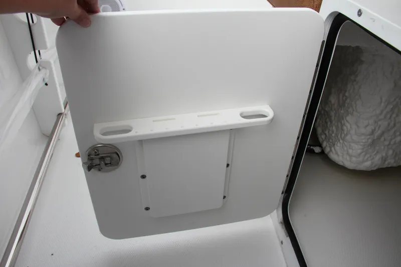 Slide: The Image of 2024 Sea Hunt Ultra 255 SE storage compartment with open hatch. - 30