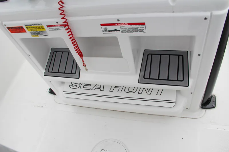 Slide: The Image of 2024 Sea Hunt Ultra 255 SE boat deck with safety warnings and logo. - 39