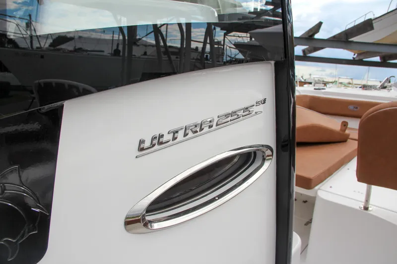 Slide: The Image of 2024 Sea Hunt Ultra 255 SE boat detail with logo and seating. - 45