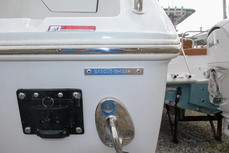Slide: The Image of 2024 Sea Hunt Ultra 255 SE boat stern with identification number. - 6