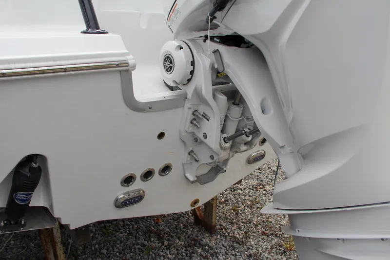 Slide: The Image of 2024 Sea Hunt Ultra 255 SE boat engine and stern details. - 7