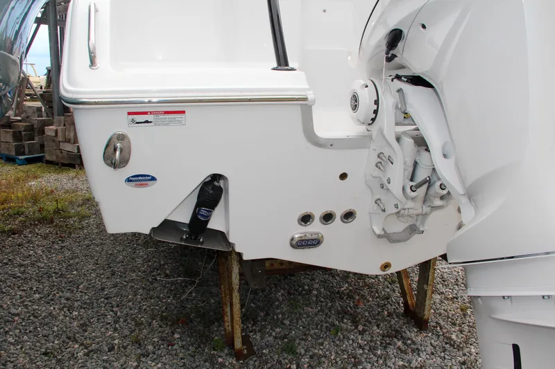 Slide: The Image of 2024 Sea Hunt Ultra 255 SE boat stern with engine mount and trim tabs. - 8