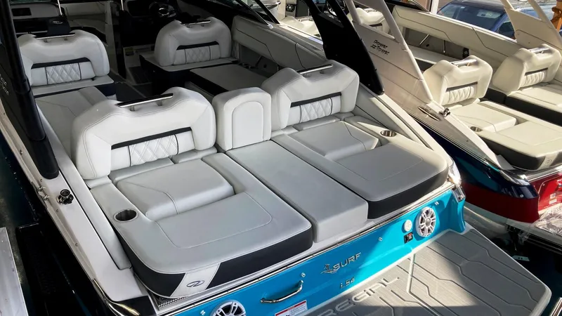 Slide: The Image of 2024 Regal LS4 Surf boat with luxurious seating and modern design. - 4