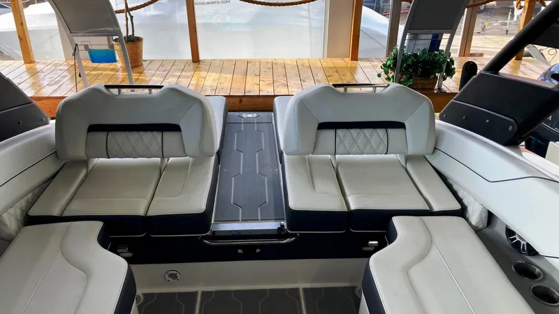 Slide: The Image of 2024 Regal LS4 Surf boat interior with luxurious seating and modern design. - 5
