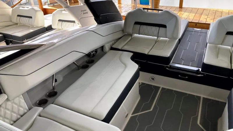 Slide: The Image of 2024 Regal LS4 Surf boat interior with luxurious white seating and modern design. - 6