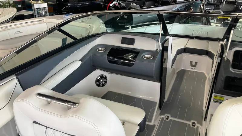 Slide: The Image of 2024 Regal LS4 Surf boat interior with white seating and modern dashboard. - 8