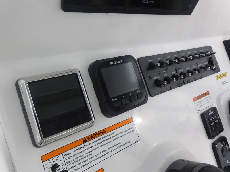 Slide: The Image of Control panel of a 2024 Blue Wave 2600 PureBay boat with Suzuki display. - 15