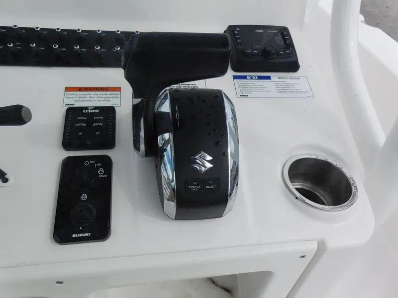 Slide: The Image of Control panel of a 2024 Blue Wave 2600 PureBay boat with Suzuki throttle. - 16