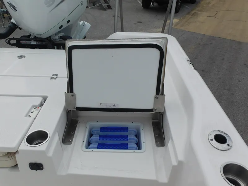 Slide: The Image of 2024 Blue Wave 2600 PureBay boat with open storage compartment. - 28