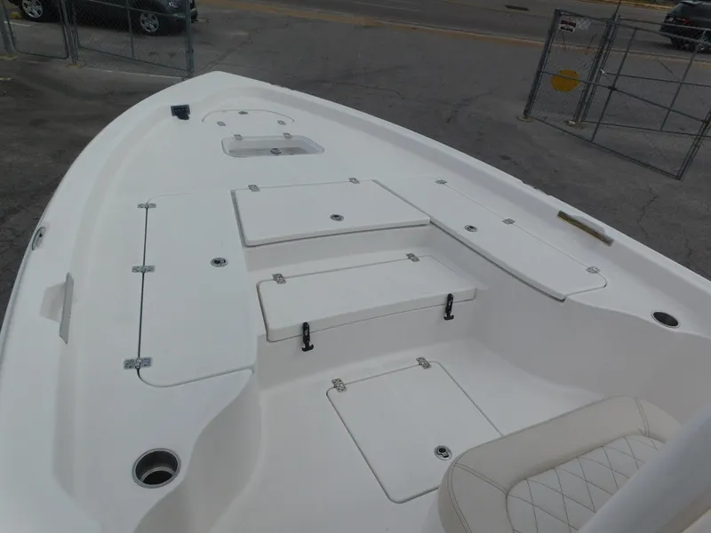 Slide: The Image of 2024 Blue Wave 2600 PureBay boat deck with storage compartments. - 6