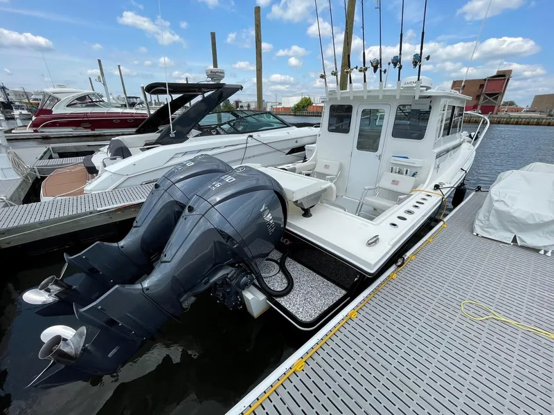 Slide: The Image of 2021 Steiger Craft 28 DV Chesapeake boat docked with twin Yamaha engines. - 29