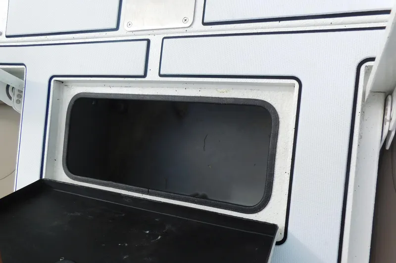 Slide: The Image of 2018 Excel 22'3 Bay Pro boat storage compartment. - 17
