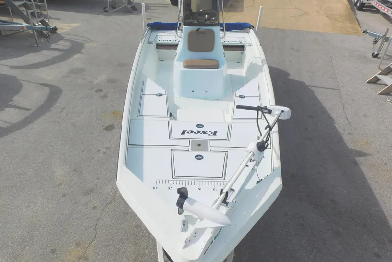 Slide: The Image of 2018 Excel 22'3 Bay Pro boat, top view, white deck, trolling motor. - 5