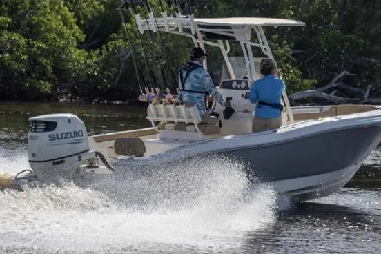 The Image of 2026 Pioneer 202 Sportfish boat on trailer, light blue hull, outdoor setting. - 0