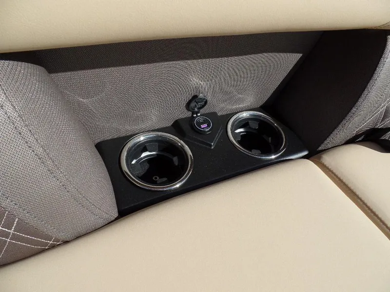 Slide: The Image of 2024 Harris Sunliner 250 boat interior cup holders and USB port. - 10