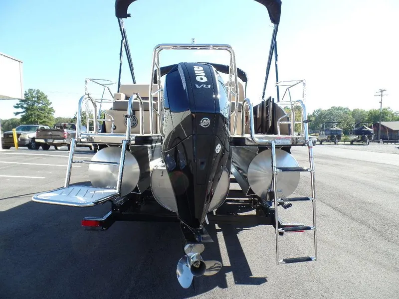 Slide: The Image of 2024 Harris Sunliner 250 pontoon boat with outboard motor and rear ladder. - 3