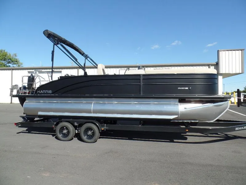 Slide: The Image of 2024 Harris Cruiser 230 pontoon boat on trailer, side view. - 1