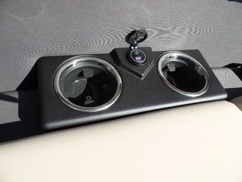 Slide: The Image of Cup holders and USB port on 2024 Harris Cruiser 230 boat. - 5