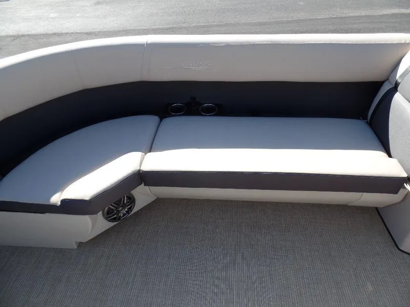 Slide: The Image of 2024 Harris Cruiser 230 boat interior seating with cup holders. - 7