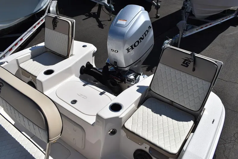 Slide: The Image of 2022 Carolina Skiff 17 LS boat with Honda 90 outboard motor and cushioned seating. - 13
