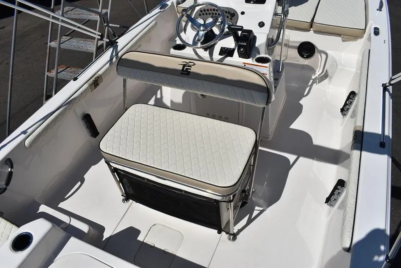Slide: The Image of 2022 Carolina Skiff 17 LS boat interior with seating and steering console. - 17