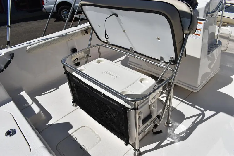 Slide: The Image of 2022 Carolina Skiff 17 LS boat with open storage compartment and cooler. - 18