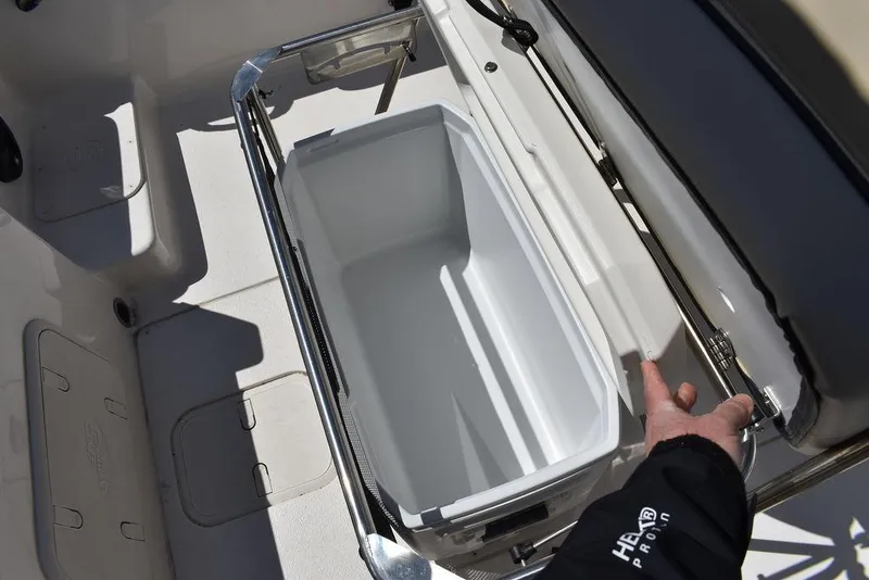 Slide: The Image of 2022 Carolina Skiff 17 LS boat with open storage compartment. - 19