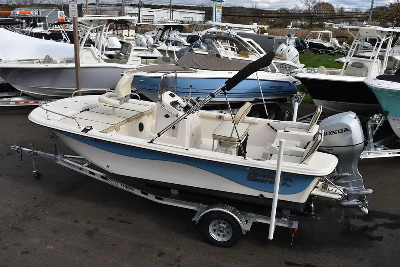 Slide: The Image of 2022 Carolina Skiff 17 LS boat on trailer in marina. - 2