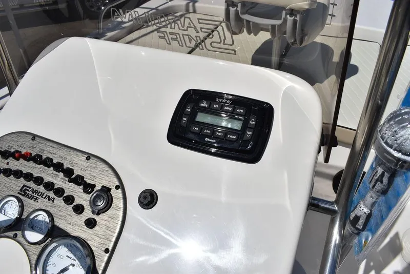 Slide: The Image of 2022 Carolina Skiff 17 LS boat dashboard with control panel and gauges. - 22