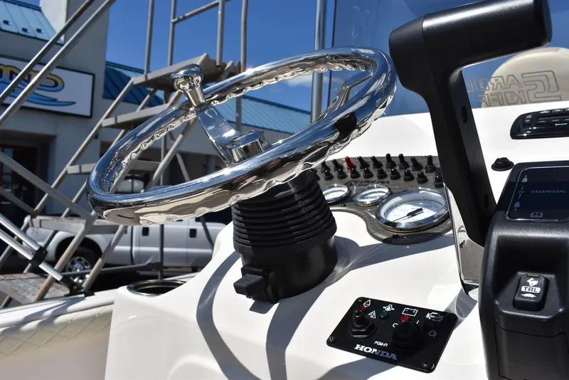 Slide: The Image of Close-up of 2022 Carolina Skiff 17 LS boat steering wheel and dashboard. - 23