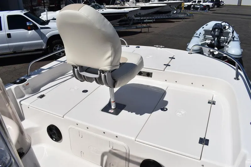 Slide: The Image of 2022 Carolina Skiff 17 LS boat with white seating and storage compartments. - 25