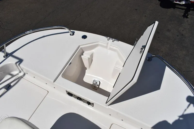 Slide: The Image of 2022 Carolina Skiff 17 LS boat storage compartment with open hatch. - 28