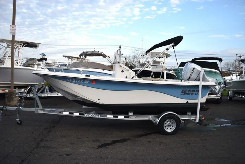 Slide: The Image of 2022 Carolina Skiff 17 LS boat on trailer in marina parking lot. - 3