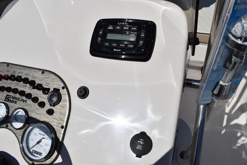 Slide: The Image of 2022 Carolina Skiff 17 LS boat dashboard with gauges and control panel. - 30