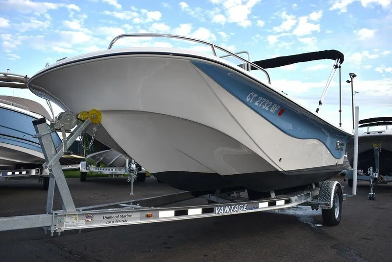 Slide: The Image of 2022 Carolina Skiff 17 LS boat on a Vantage trailer, parked outdoors. - 31