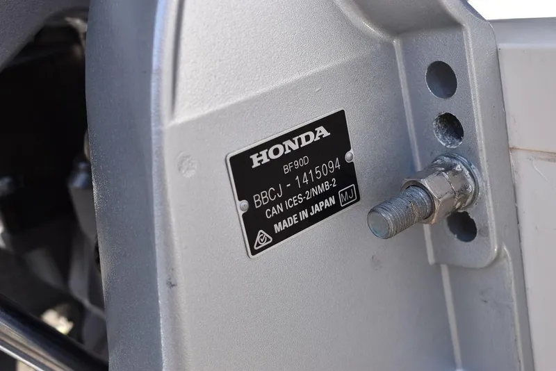 Slide: The Image of Close-up of a Honda engine part on a 2022 Carolina Skiff 17 LS boat. - 33