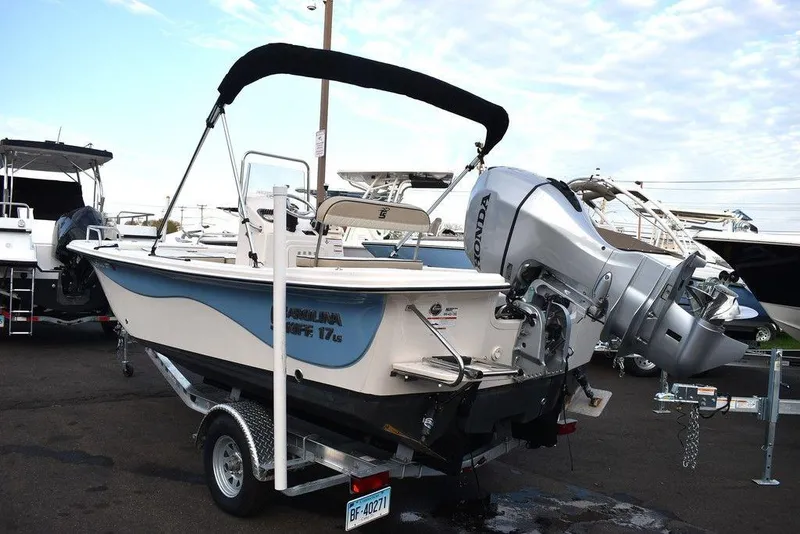 Slide: The Image of 2022 Carolina Skiff 17 LS boat with Honda outboard motor on trailer. - 5