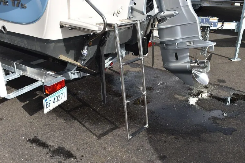 Slide: The Image of 2022 Carolina Skiff 17 LS boat stern with ladder and outboard motor. - 6