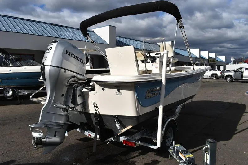 Slide: The Image of 2022 Carolina Skiff 17 LS boat with Honda outboard motor on trailer. - 7