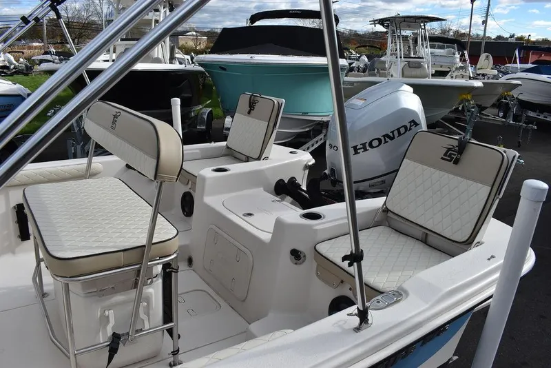 Slide: The Image of 2022 Carolina Skiff 17 LS boat interior with Honda outboard motor. - 9