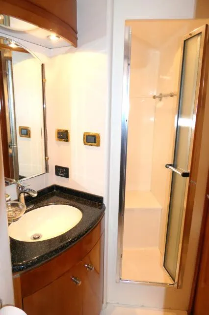 Slide: The Image of 2001 Carver 530 Voyager Pilothouse bathroom with sink and shower - 18