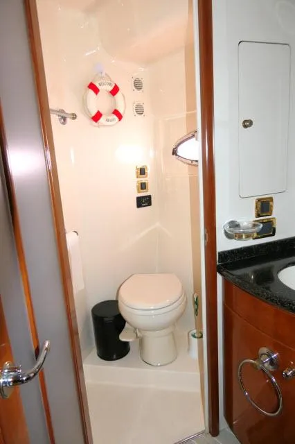 Slide: The Image of Compact bathroom in 2001 Carver 530 Voyager Pilothouse yacht with toilet and sink. - 20