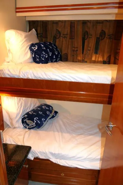Slide: The Image of Bunk beds in the 2001 Carver 530 Voyager Pilothouse cabin. - 21