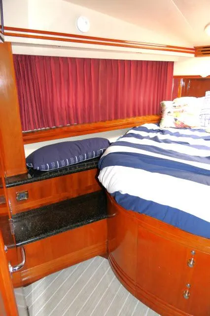 Slide: The Image of Luxurious bedroom in a 2001 Carver 530 Voyager Pilothouse yacht. - 26